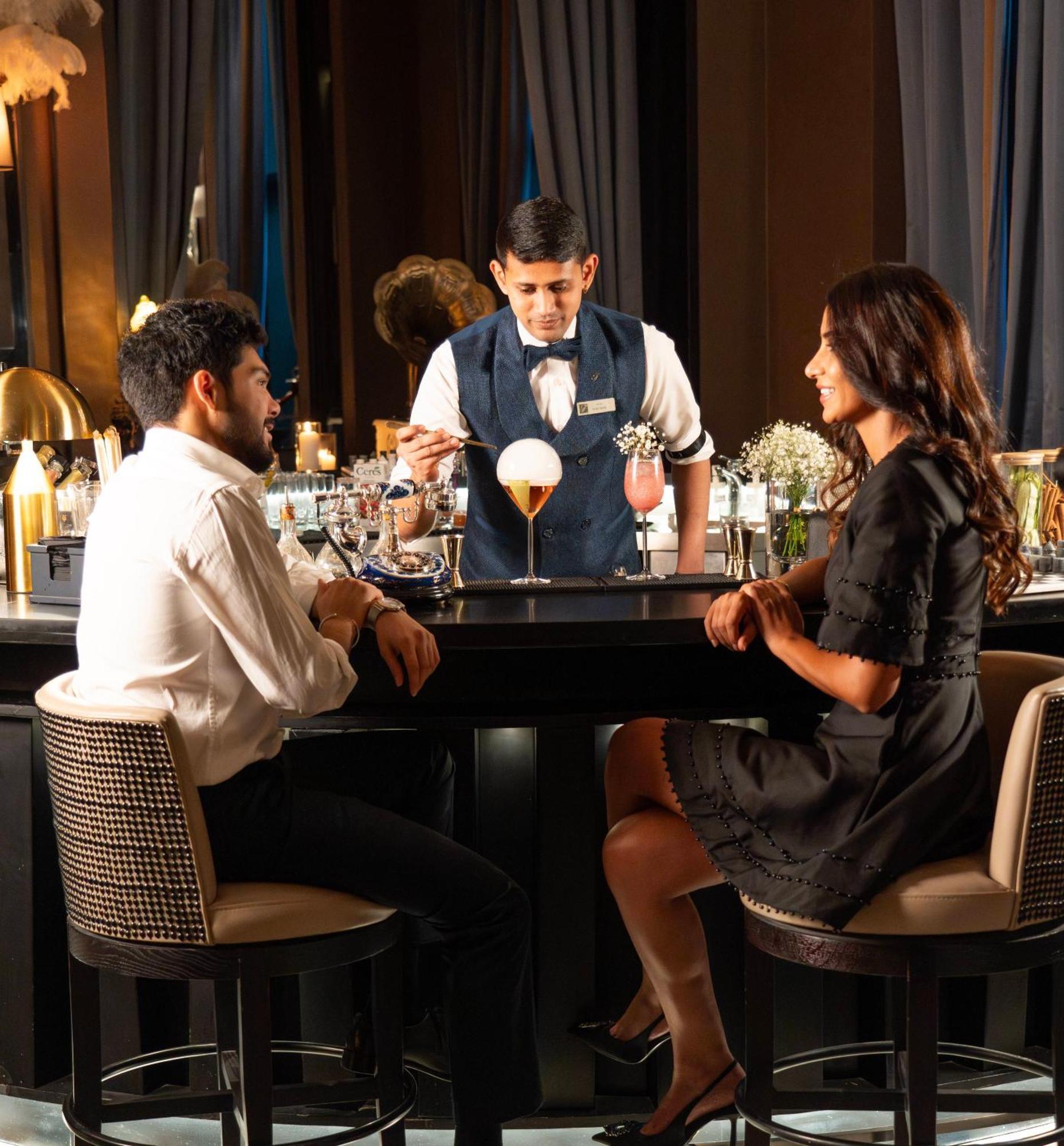 Fairmont Riyadh Eksteriør billede A bartender serving drinks